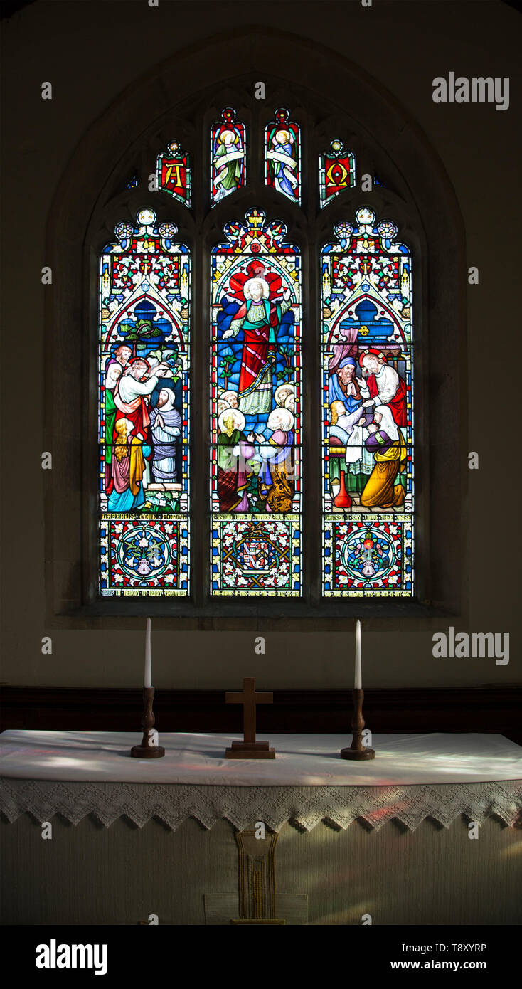 Raising of Lazarus, Ascension, Raising of daughter of Jairus stained glass window Lavers and Barraud 1867, Stanton St Bernard, Wiltshire, England, UK Stock Photo