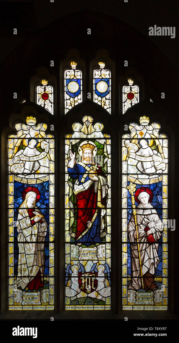 Saint Bernard, Jesus Christ, Virgin Mary stained glass window by Burlisson and Grylls 1906, Stanton St Bernard, Wiltshire, England, UK Stock Photo