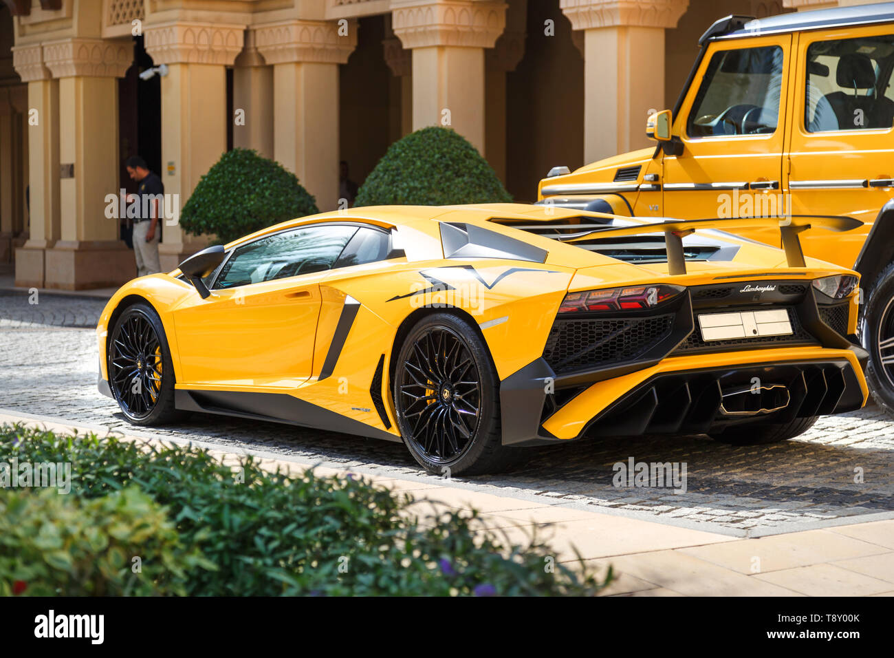 DUBAI, UAE - JANUARY 08, 2019: yellow luxury supercar Lamborghini Aventador Roadster and Gelandewagen. Stock Photo