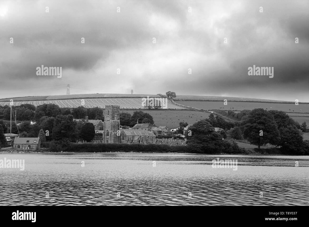 View of St. Winnow church on the banks of the Fowey River, near Lostwithiel, Cornwall, UK.  Black and white version Stock Photo