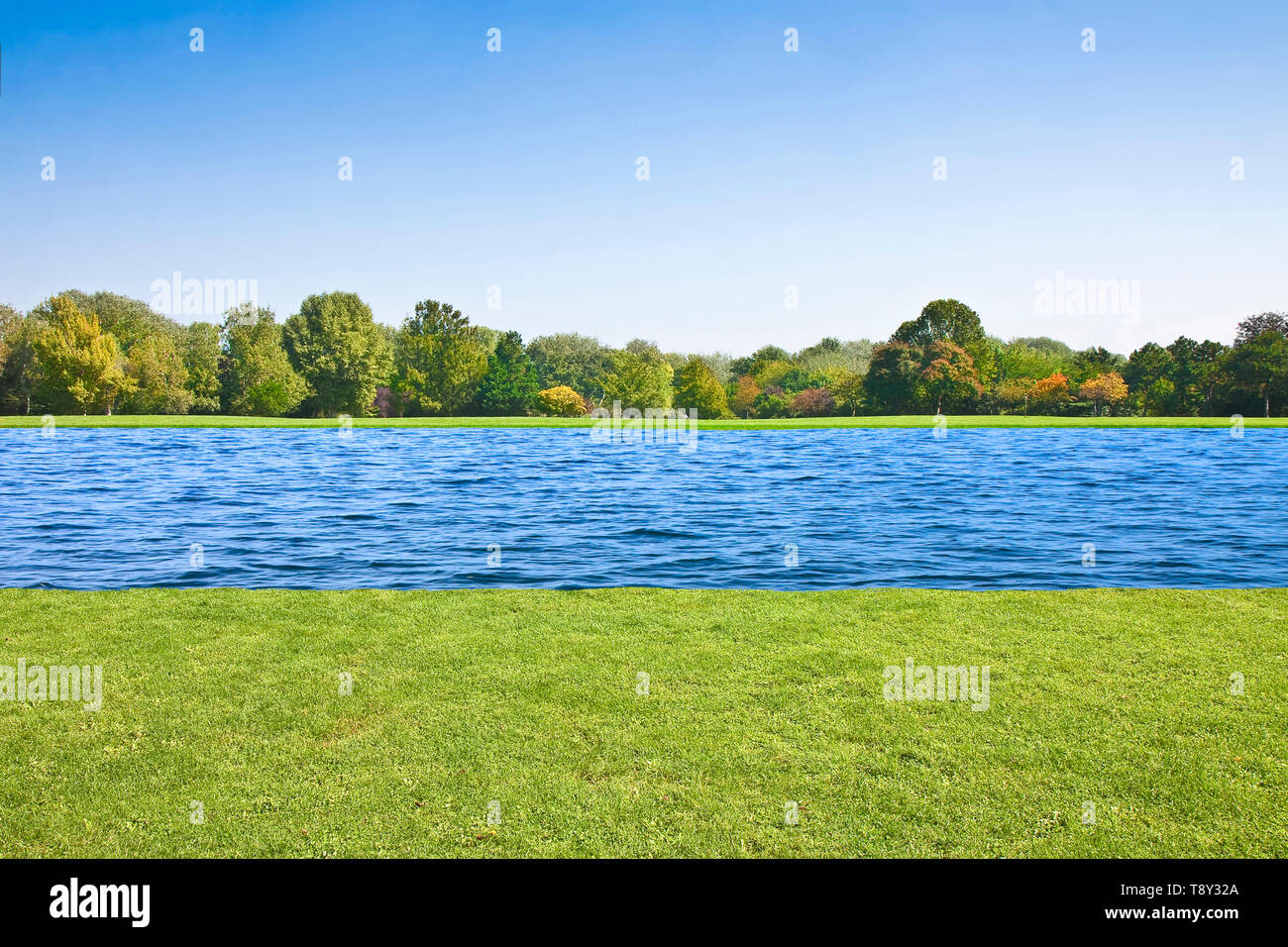 A River Flows Quietly On A Flat Land With Mowed Lawn And Trees Stock Photo Alamy