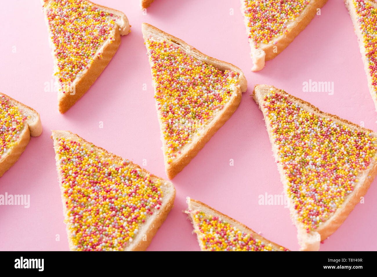 Traditional Australian fairy bread pattern on pink background Stock Photo