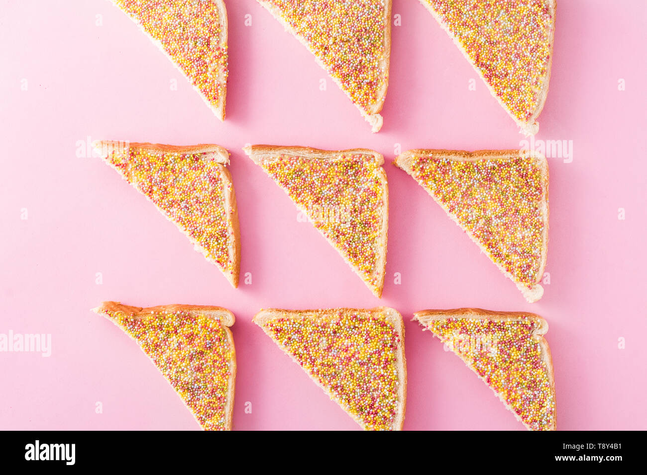Traditional Australian fairy bread pattern on pink background Stock Photo