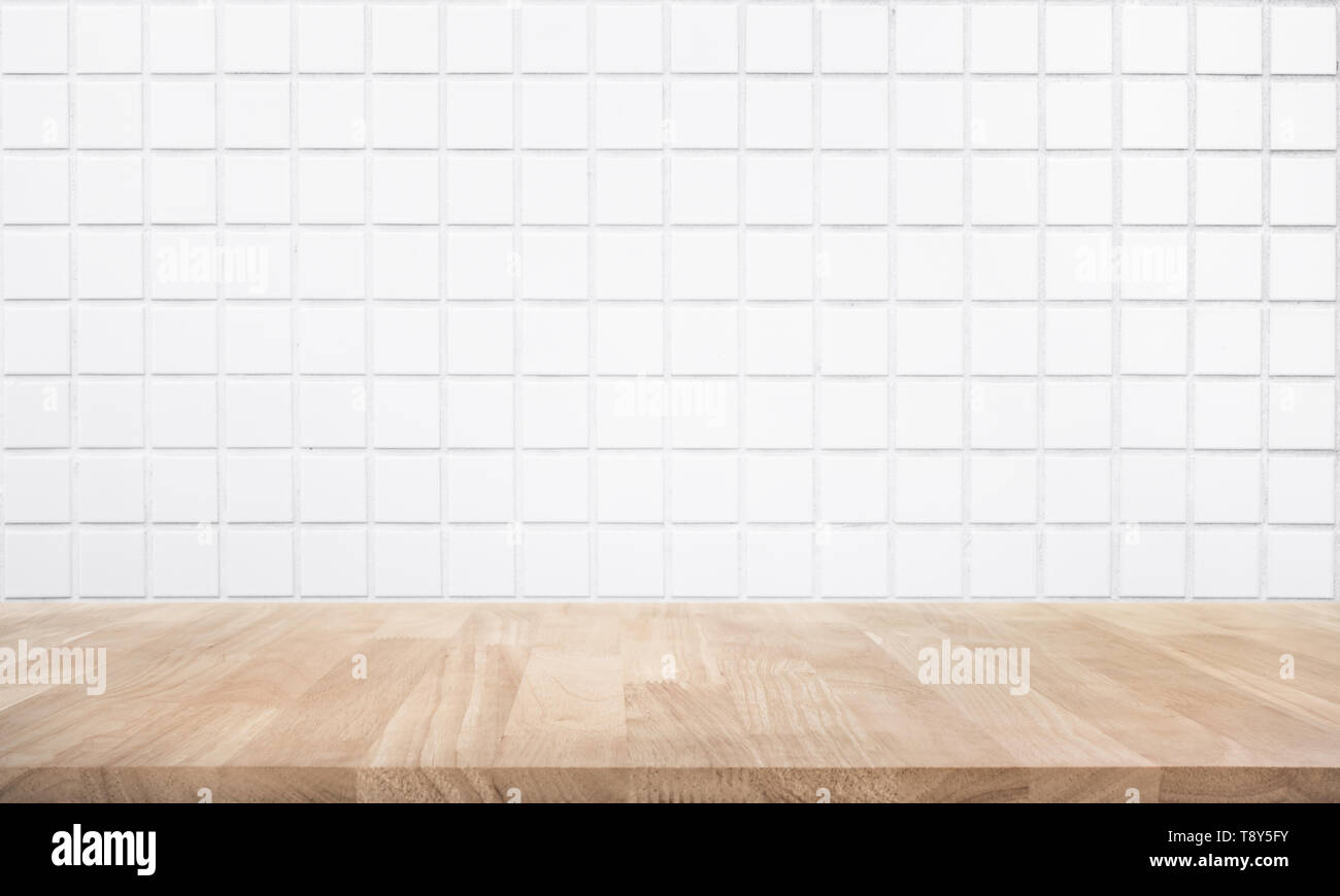 Empty wood table top with brick wall background. Stock Photo