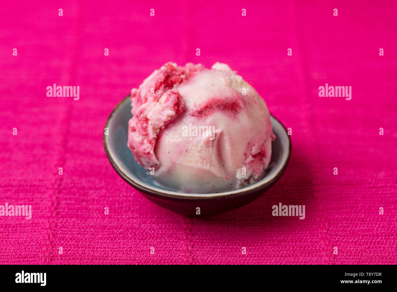 Homemade fresh scoop of vanilla ice cream with wild berry variegato Stock Photo