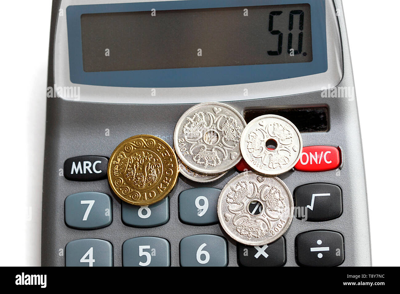 mixed-danish-coins-on-a-calculator-accounting-concept-the-krone-is
