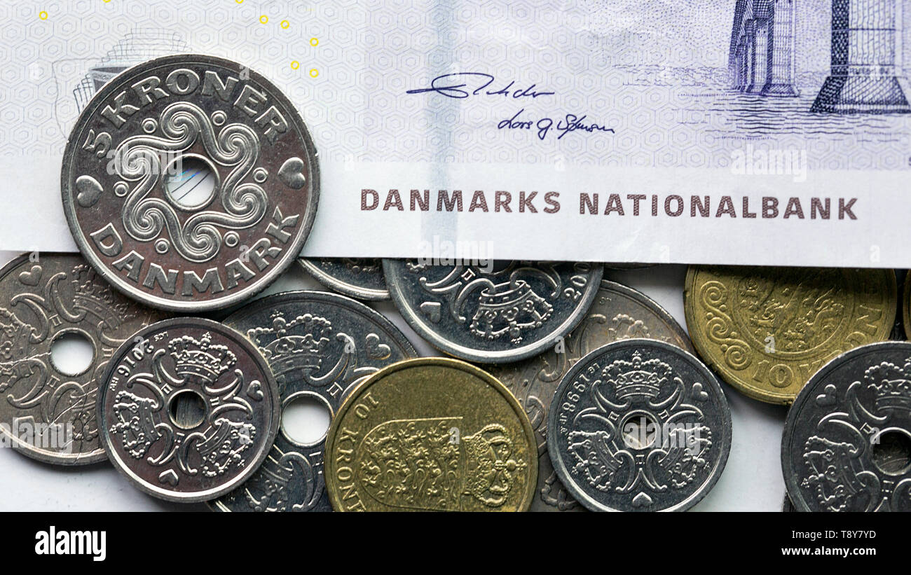 Danish coin over a fifty krone noteThe krone is the official currency