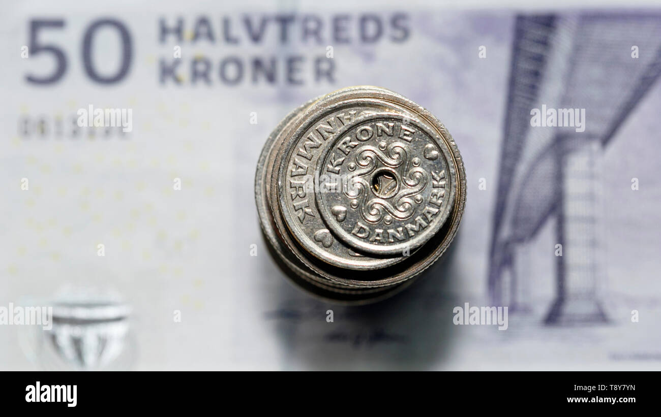 Danish coin over a fifty krone noteThe krone is the official currency