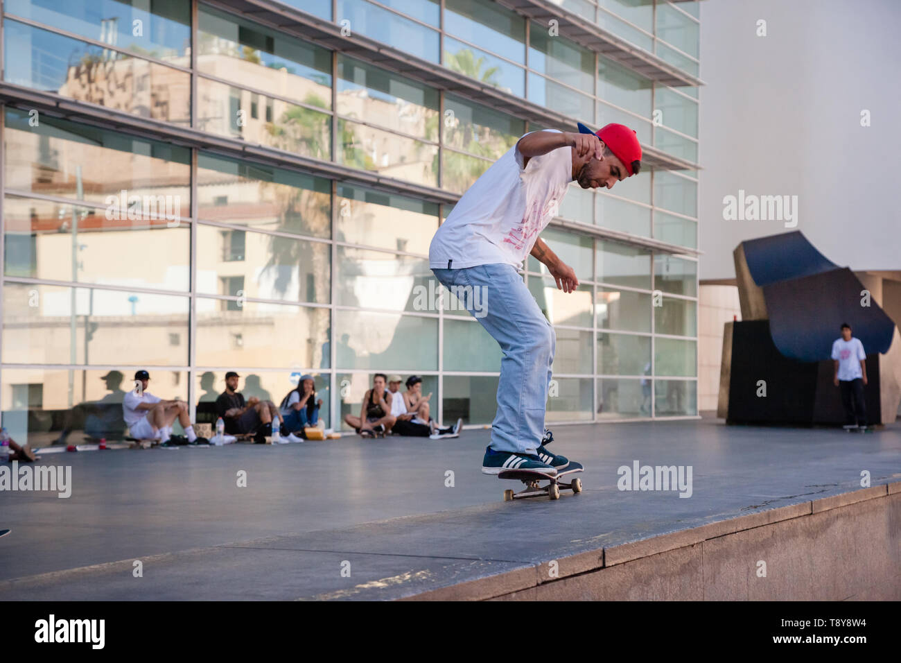 Young people skating in front of the MacBa museum, Barcelona Stock Photo