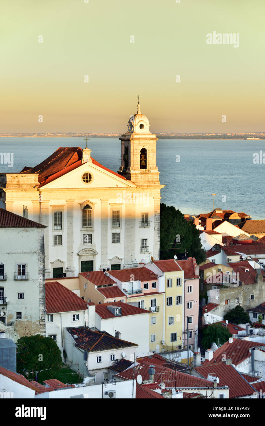 Alfama district at twilight and the Tagus river. Lisbon, Portugal Stock Photo