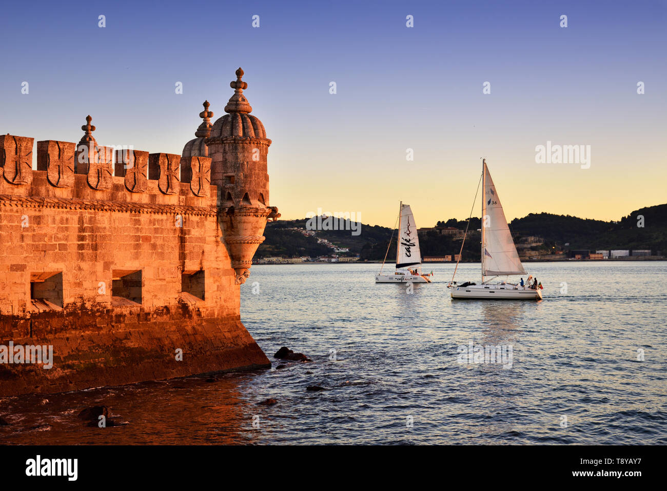 Torre de Belém (Belém Tower), in the Tagus river, a UNESCO World Heritage Site built in the 16th century in Portuguese Manueline Style at twilight. It Stock Photo