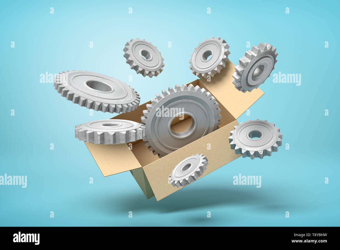 3d rendering of cardboard box in air full of grey metal cogwheels flying out from it on light-blue background. Stock Photo