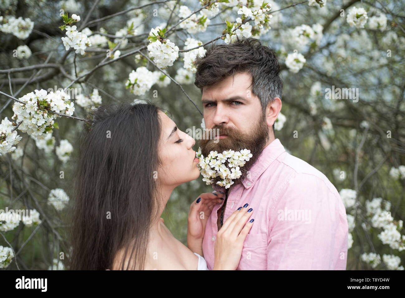 Couple In Love At Blooming Garden Tender Woman With Long Dark