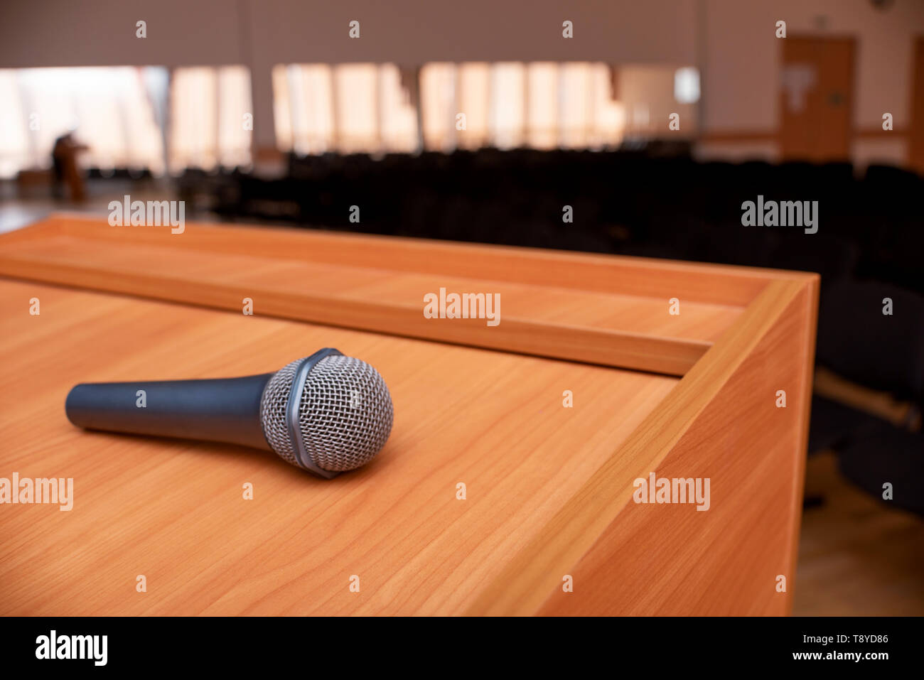 microphone on tribune in front of meeting room empty chairs Stock Photo ...