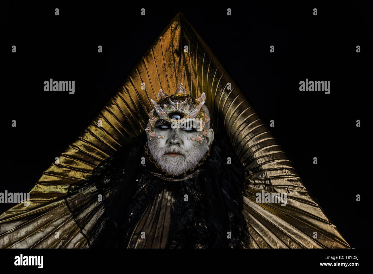 Creepy sea monster with thorns, dragon skin resting in his realm, almighty  deity. Bearded man with alien or reptilian make-up in dark outfit with  Stock Photo - Alamy