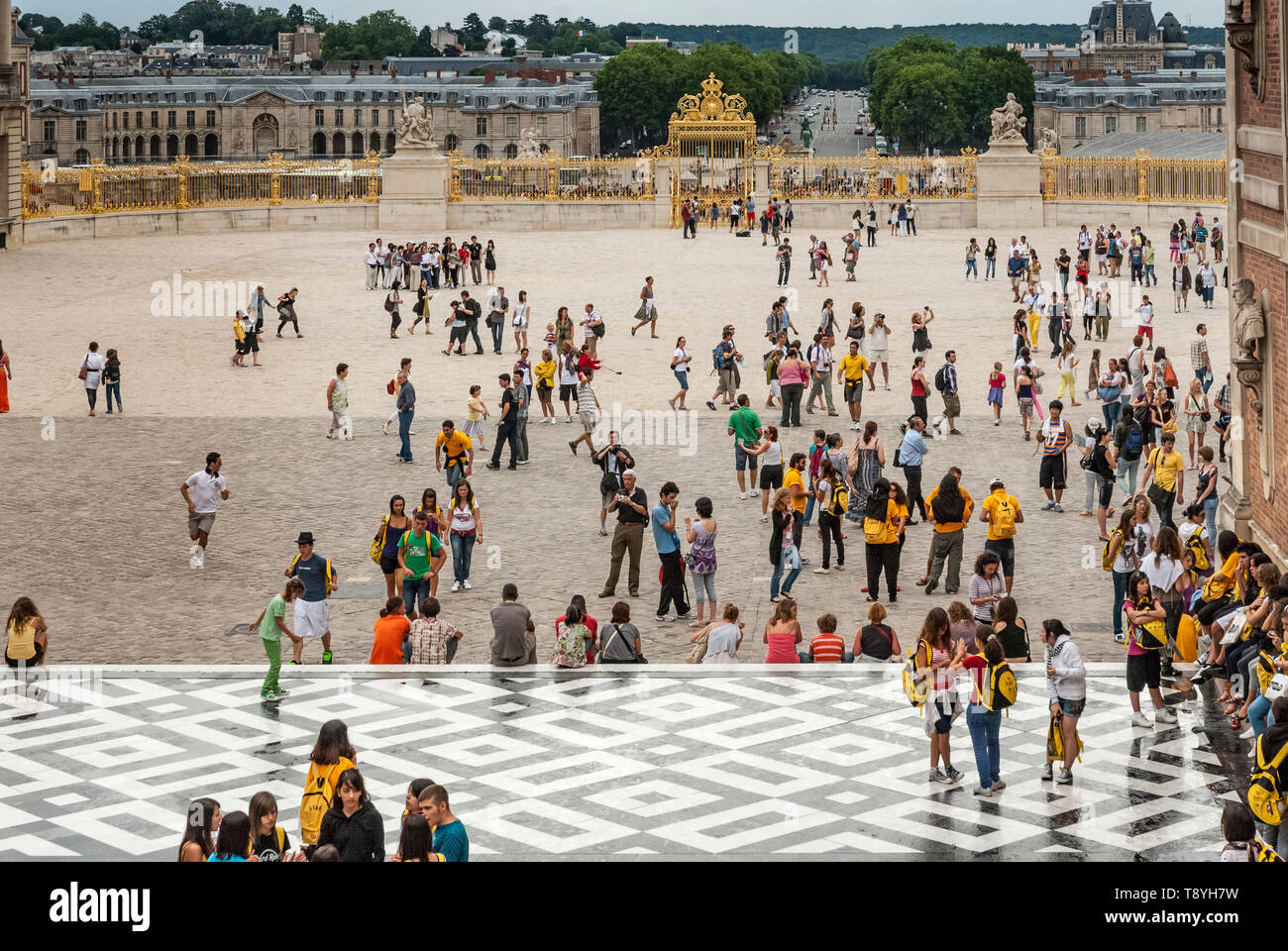 Tourist crowds on the square in front of the Palace of Versailles Stock Photo