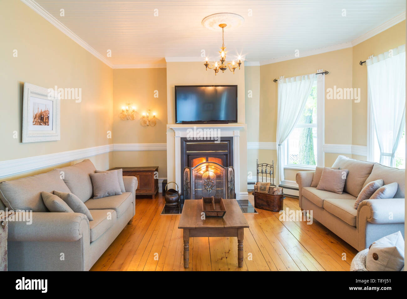 Grey Beige Upholstered Sofas With Antique Wooden Coffee Table And
