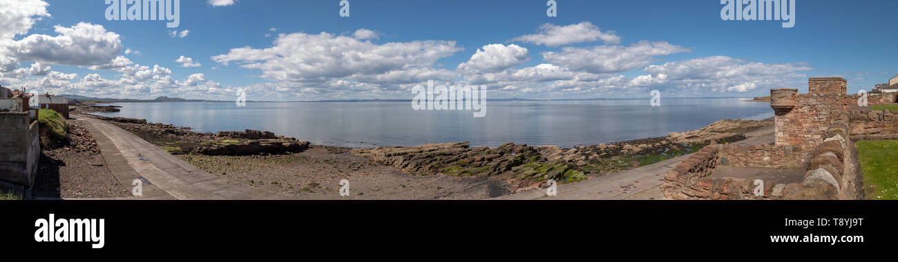 A panoramic view of the beach and North Sea at Prestonpans in East Lothian, Scotland.The land in the distance is the east coast of Fife. Stock Photo