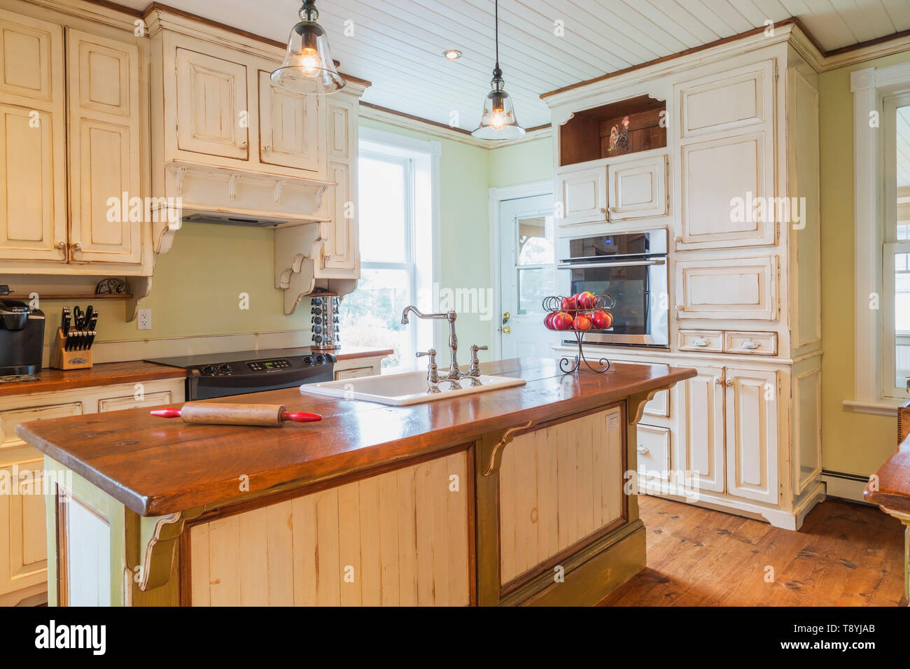 Oil Stained Wood Top Pinewood Island Cream Coloured Cabinets And