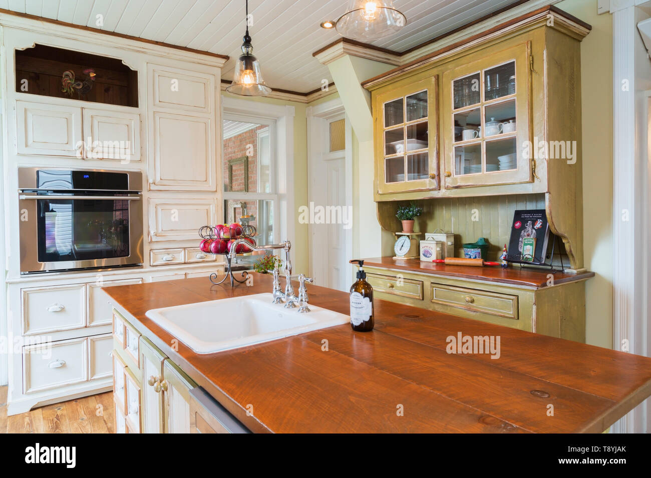 Oil Stained Wood Top Pinewood Island Cream Coloured Cabinets And