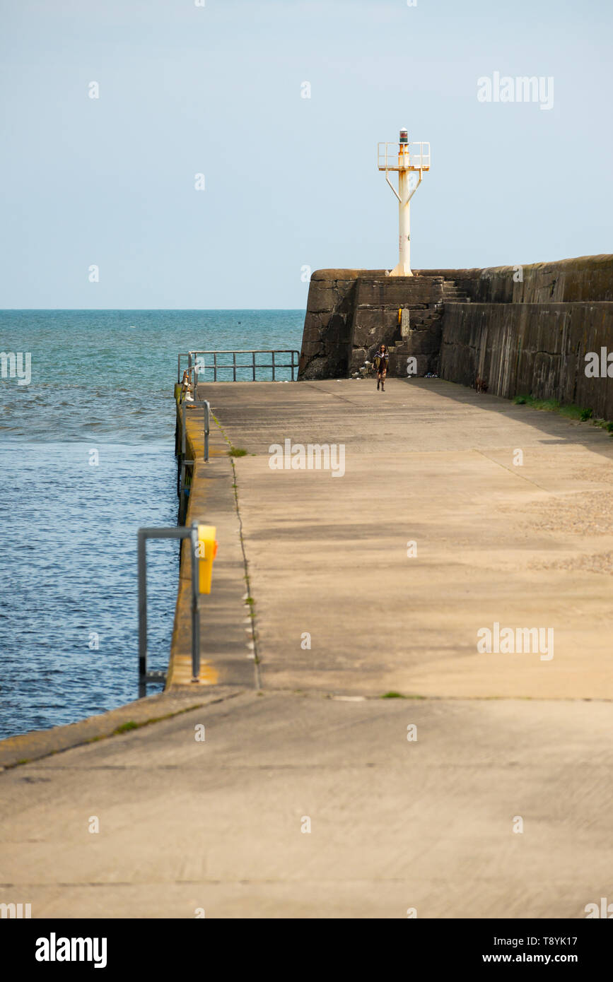 Breakwater with lighthouse at Arklow Stock Photo