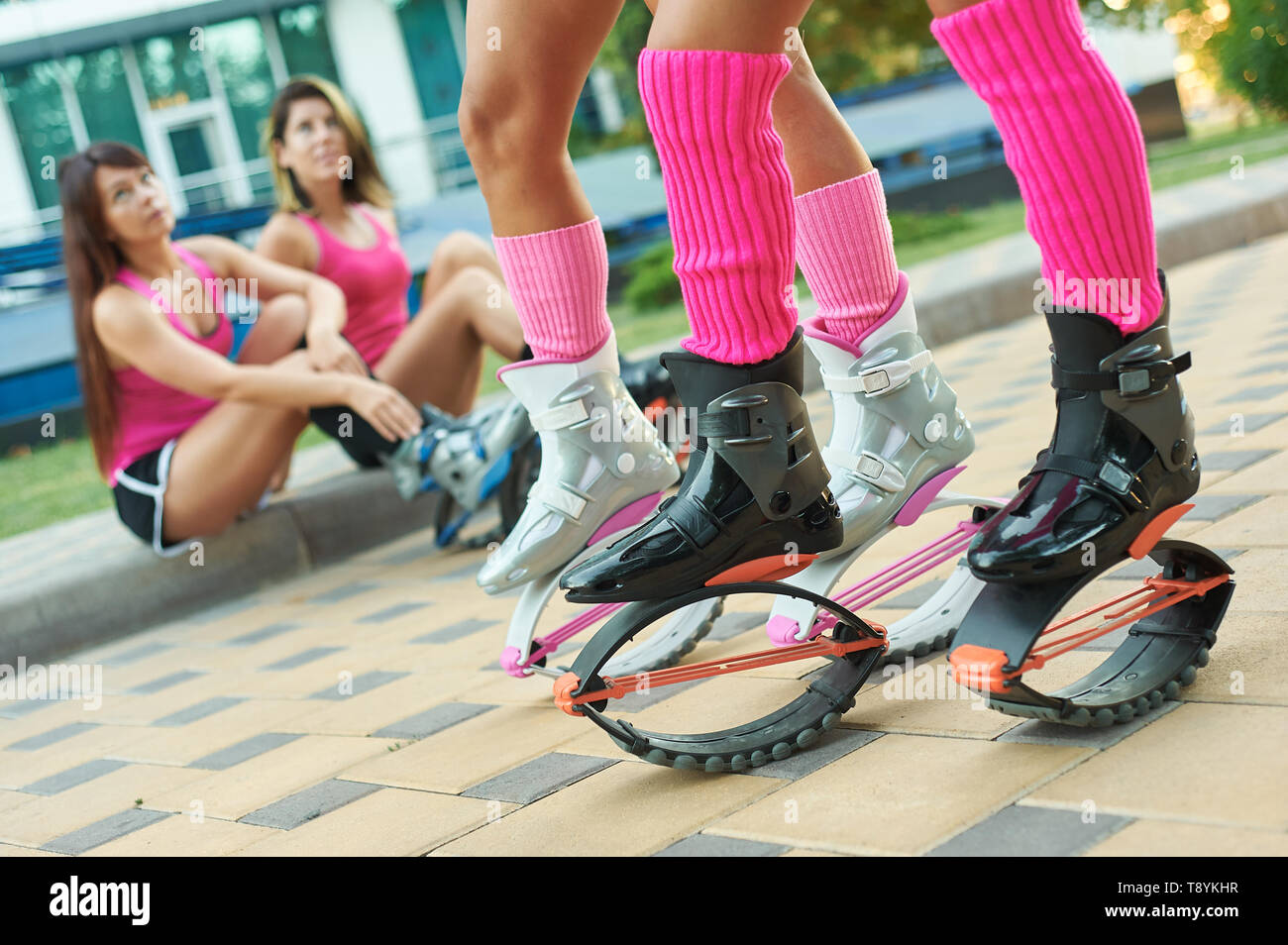kangoo jumping fitness women team in boots. close up shot with blurred  background. black and pink colours boots. fitness training concept Stock  Photo - Alamy