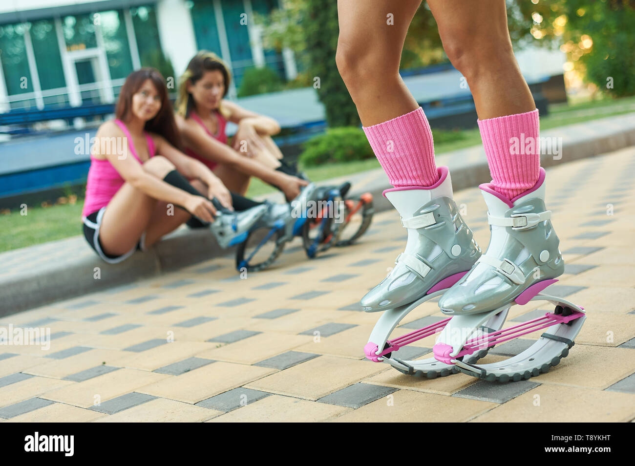 kangoo jumping fitness women team in boots. close up shot with blurred background. sport training concept Stock Photo