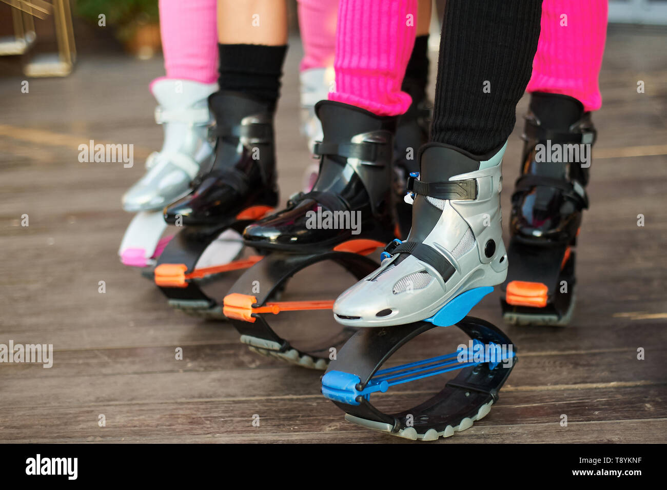 kangoo jumping fitness women team in boots. close up shot with