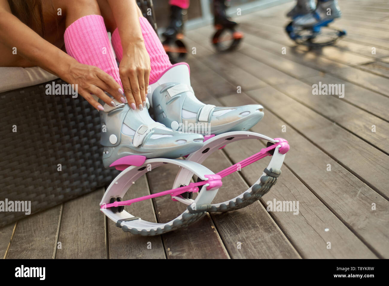 Woman Keeps Pink Kangoo Jumps Boots in Hand and Shows Thumbs Up Stock Photo  - Image of activity, female: 125151176