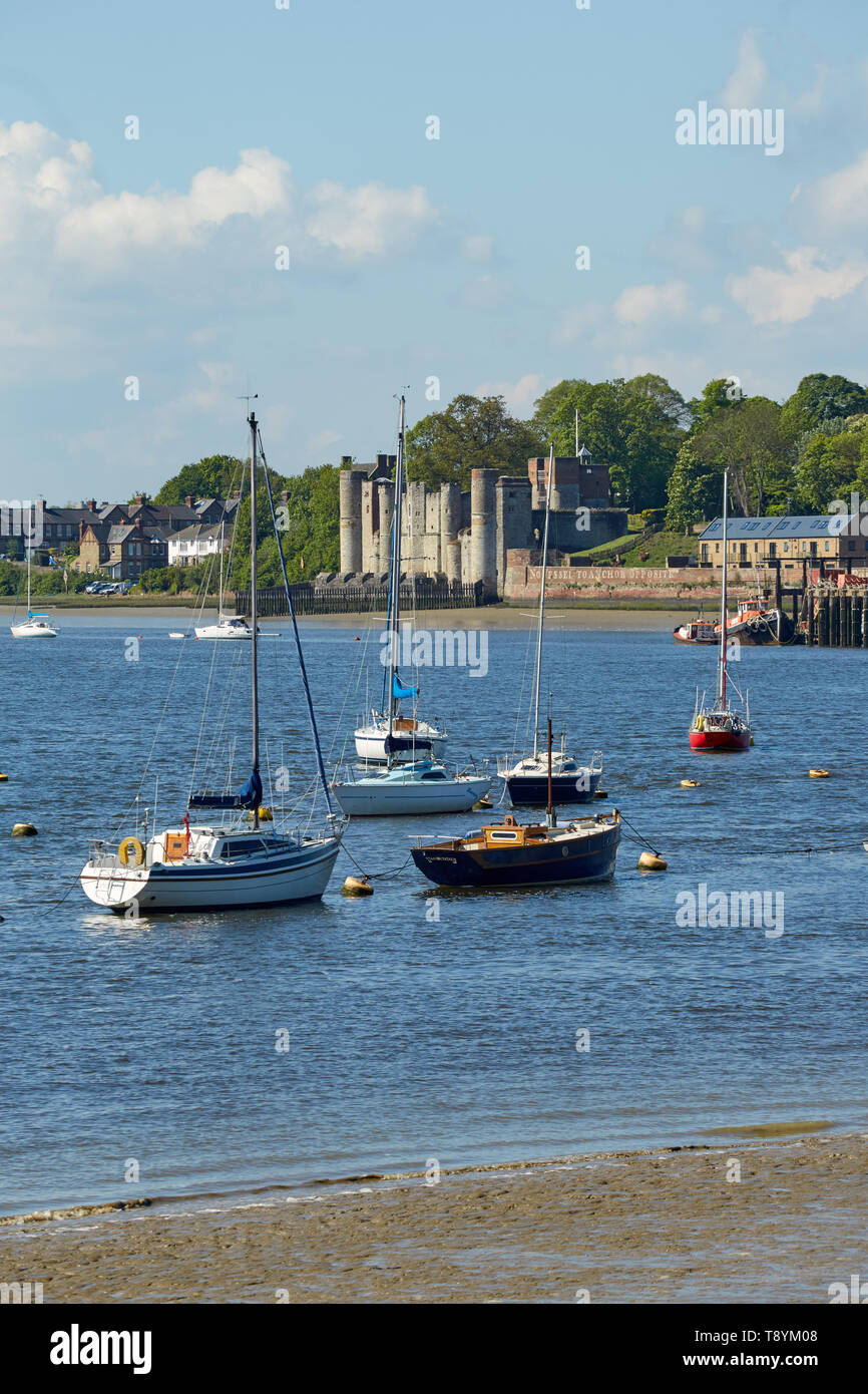 Yachts at moorings on the River Medway at Lower Upnor, Kent,UK. Showing Upnor Castle in the distance. Stock Photo