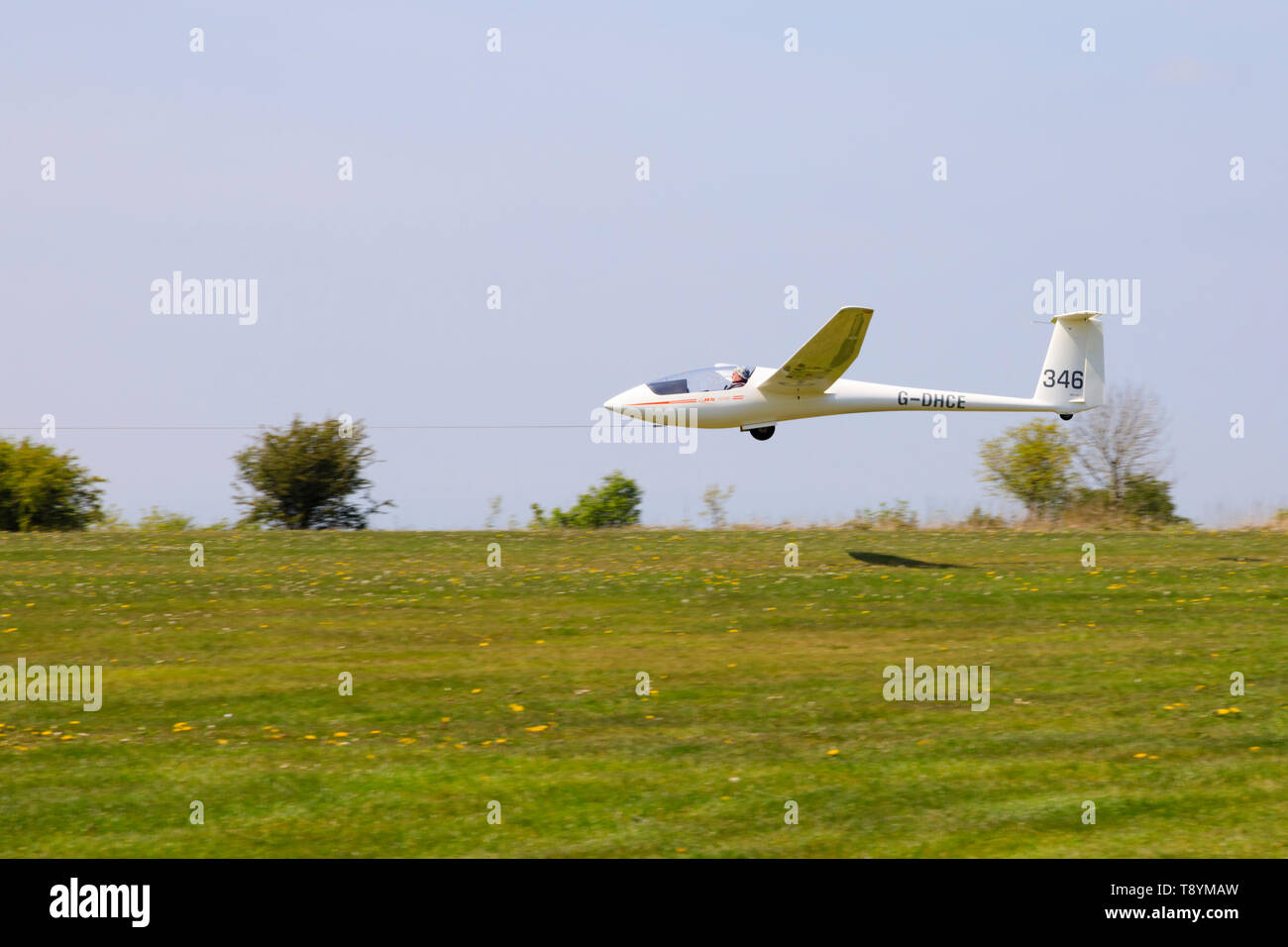 Alexander Schleicher ASW19b glider launching on aerotow, Yorkshire Gliding Club airfield at Sutton Bank in the North Yorkshire Moors National Park. Stock Photo