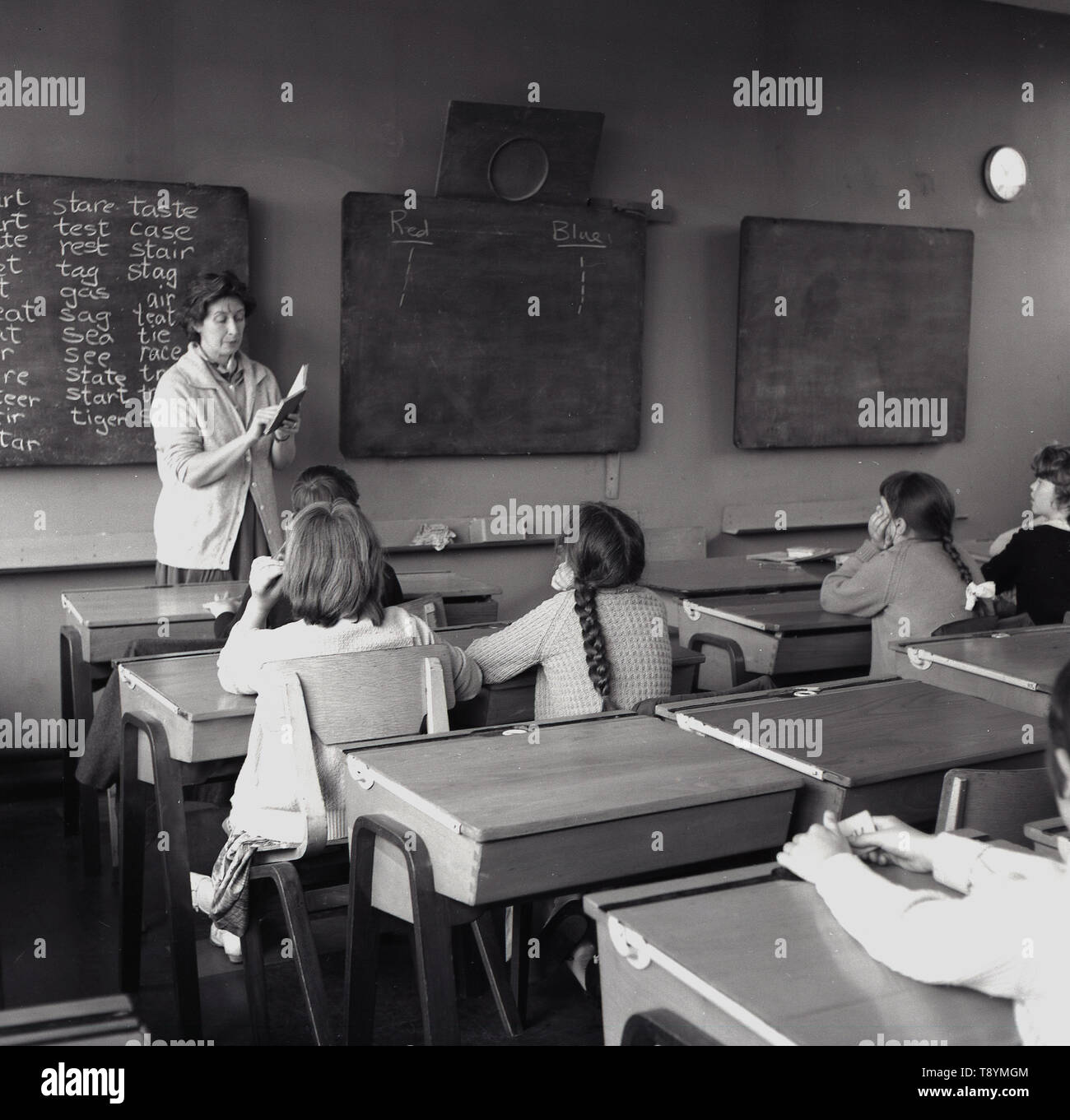 1960s, historical, children in a classroom , sitting at wooden desks