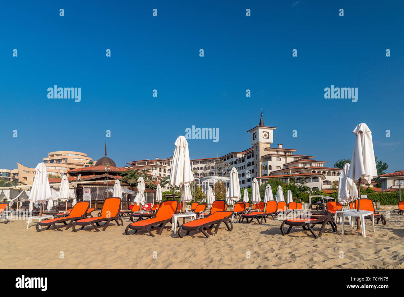Sunny Beach, Bulgaria - 2 Sep 2018: Umbrellas and chair lounges at Sunny Beach coastline, a major seaside resort on the Black Sea coast of Bulgaria. Stock Photo