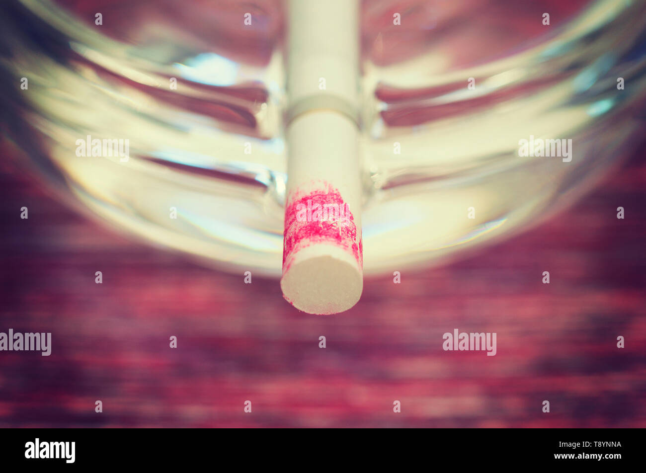 lipstick stained cigarette on ashtray Stock Photo Alamy