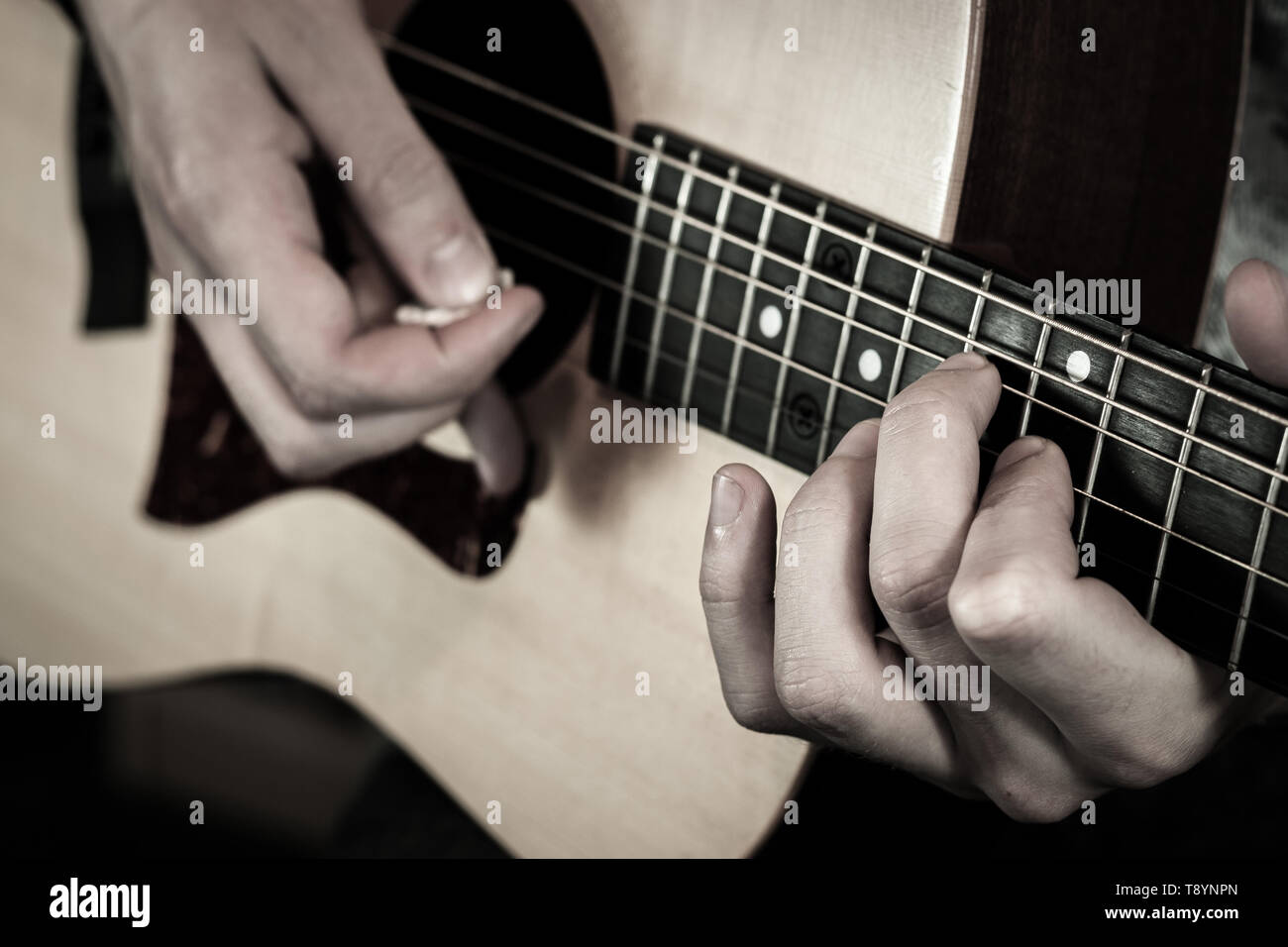 Acoustic guitar being played high up the fretboard Stock Photo Alamy