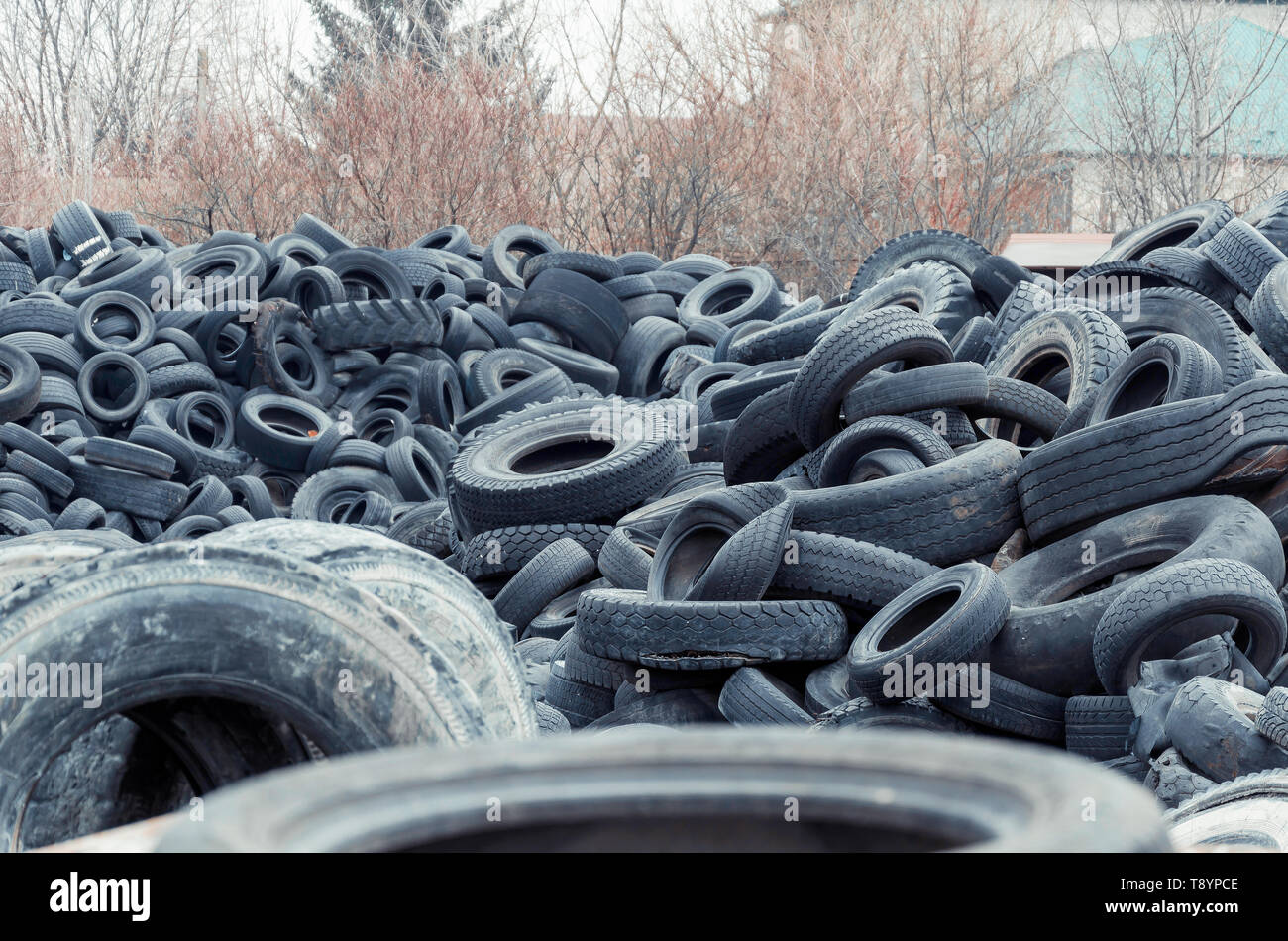 Wheel worn wear rubber tyre junkyard recycling heap hires stock