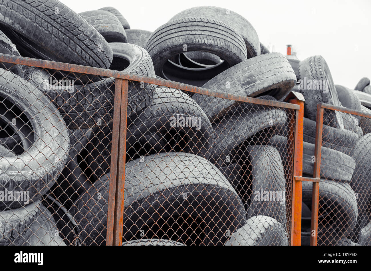 Wheel worn wear rubber tyre junkyard recycling heap hires stock