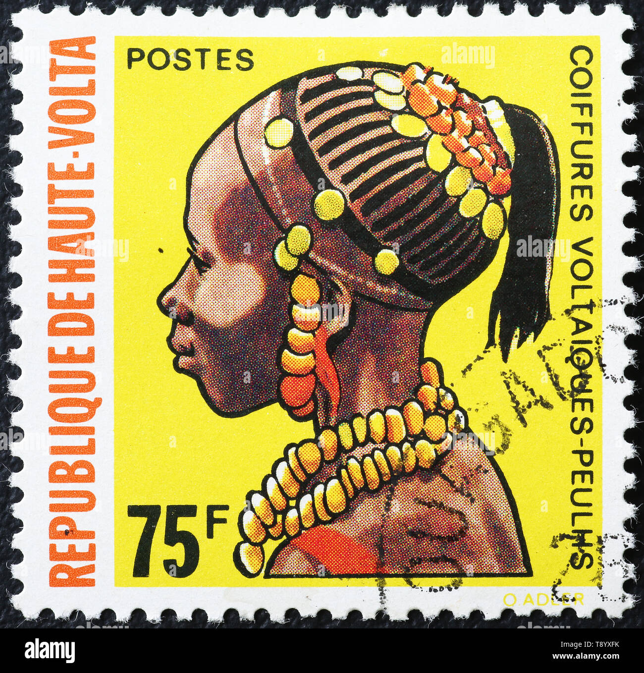 Elaborate hairstyle pf african woman on stamp of Alto Volta Stock Photo