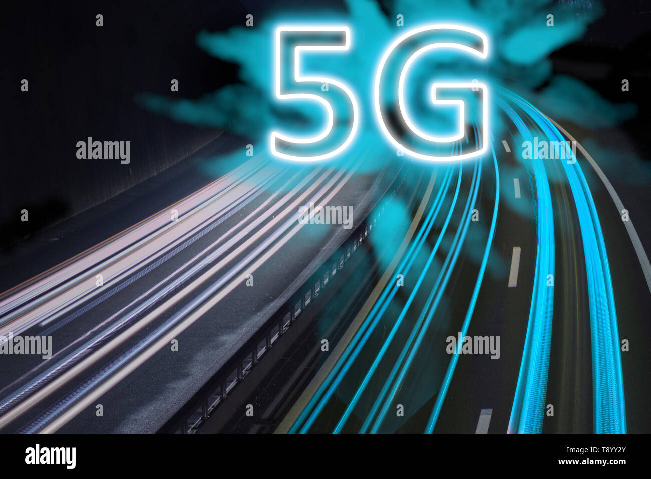 5G network wireless systems and internet shown with blue trail lights on highway. Stock Photo