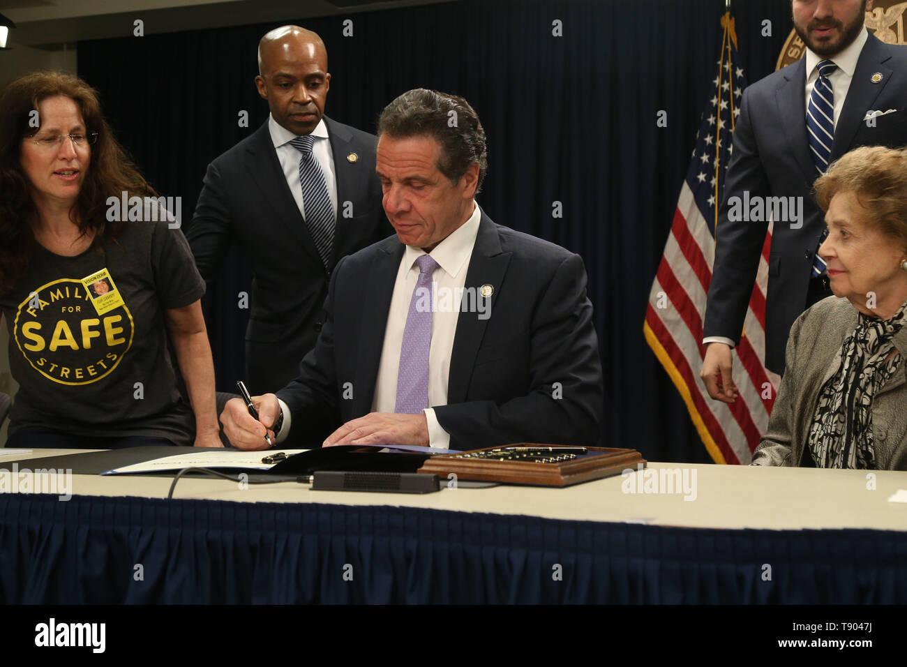 May 12, 2019 - New York, NY, USA - May 12, 2019 -  Governor Andrew M. Cuomo signed legislation at a press conference to set up speed cameras in front of New York schools at  the New York State Offices on 633 3rd Avenue. Clockwise : Founder of Families For Safe Streets  Amy Cohen, Counsel to the Governor Alphonso David, State Senator D-22 Andrew Gounardes , NY State Assemblywoman D-66 Deborah Glick, and Matilda Cuomo surround Governor Andrew Cuomo as he signs the bill. (Credit Image: © Dan Herrick/ZUMA Wire) Stock Photo