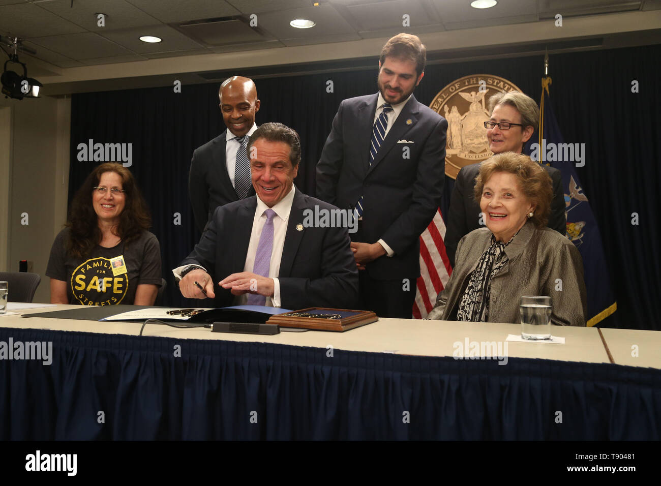 May 12, 2019 - New York, NY, USA - May 12, 2019 -  Governor Andrew M. Cuomo signed legislation at a press conference to set up speed cameras in front of New York schools at  the New York State Offices on 633 3rd Avenue. Clockwise : Founder of Families For Safe Streets  Amy Cohen, Counsel to the Governor Alphonso David, State Senator D-22 Andrew Gounardes , NY State Assemblywoman D-66 Deborah Glick, and Matilda Cuomo surround Governor Andrew Cuomo as he signs the bill. (Credit Image: © Dan Herrick/ZUMA Wire) Stock Photo