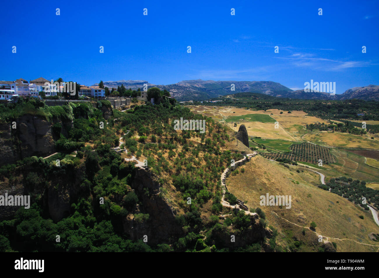 View on ancient village Ronda located on plateau surrounded by rural plains in Andalusia, Spain Stock Photo