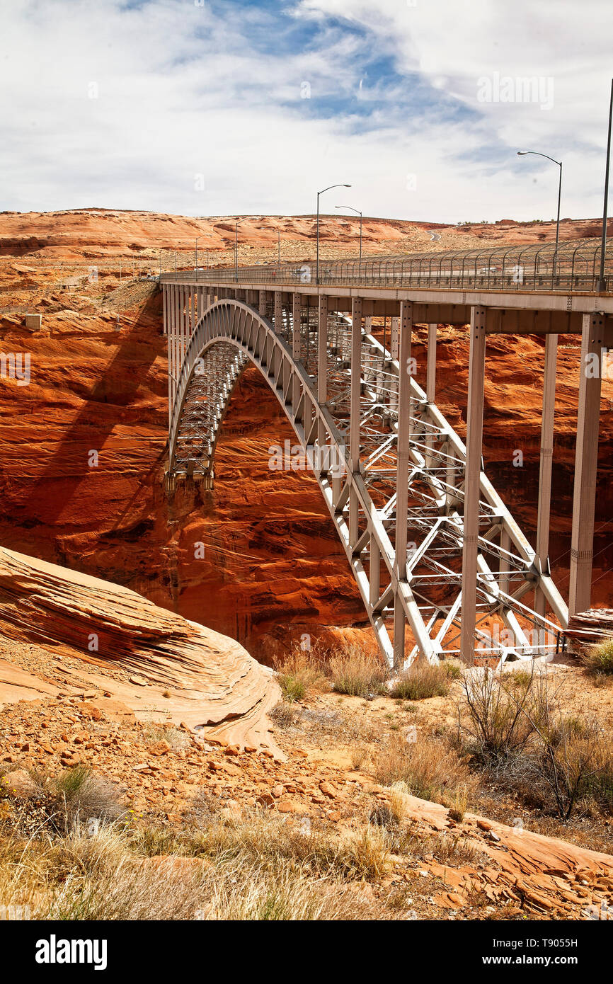 The Glen Canyon Bridge is located by Glen Canyon Dam and is a steel arch bridge with an overall length of 1,271 feet. Page, Arizona.  USA Stock Photo