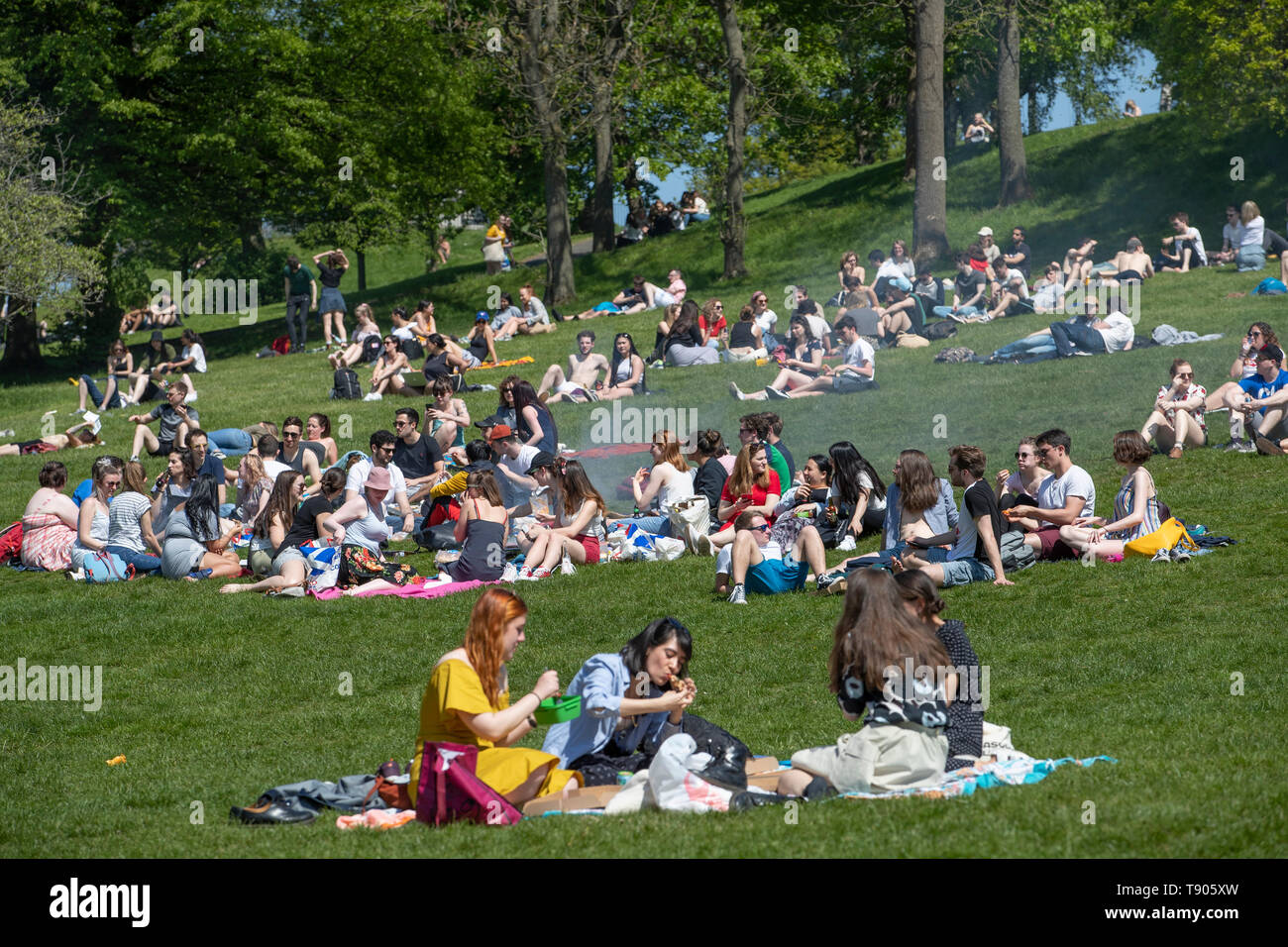 People enjoy the sunshine in Glasgow's Kelvingrove Park as the hot