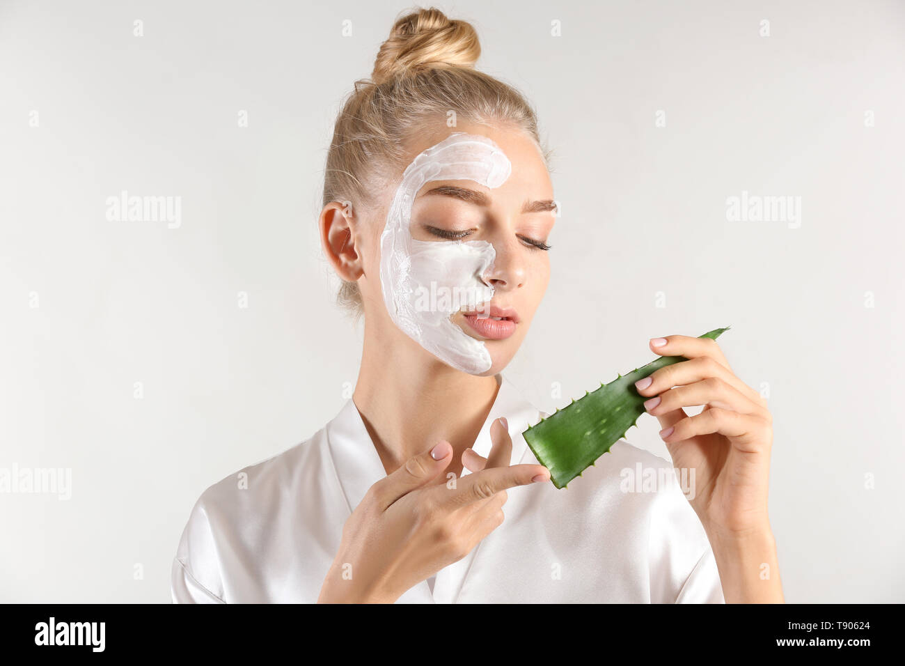 Download Beautiful Young Woman With Facial Mask Containing Aloe Vera Extract On Light Background Stock Photo Alamy Yellowimages Mockups