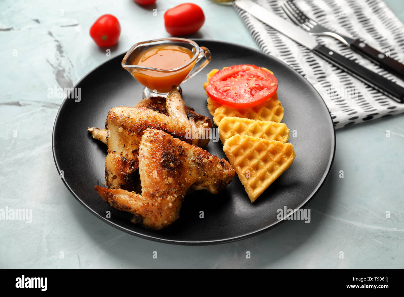 Delicious Waffles With Chicken Wings And Sauce On Plate Stock Photo Alamy