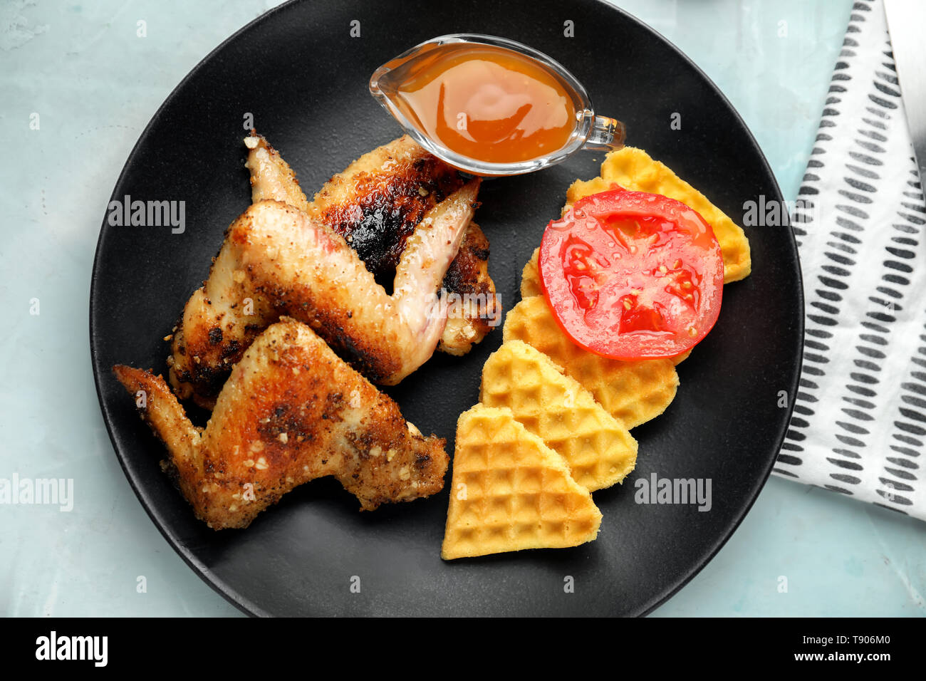 Delicious Waffles With Chicken Wings And Sauce On Plate Stock Photo Alamy