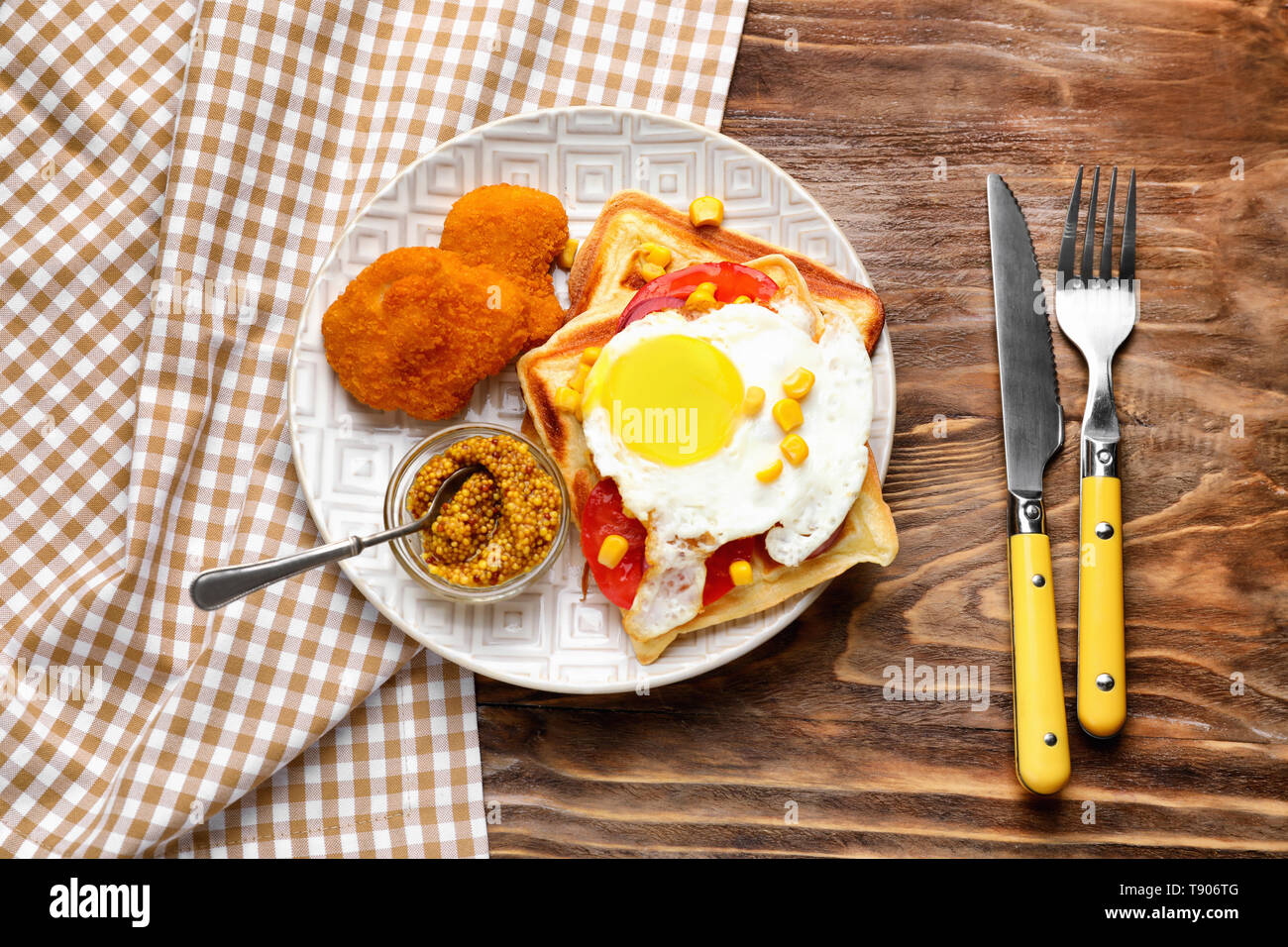 Delicious Waffles With Chicken Nuggets Mustard And Fried Egg On Plate Stock Photo Alamy