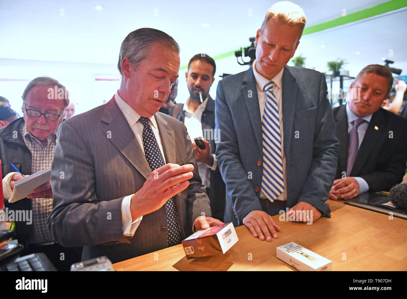 Brexit Party leader Nigel Farage visits a vape shop with the party's lead  candidate in Wales, Nathan Gill, during a walkabout in Merthyr Tydfil Stock  Photo