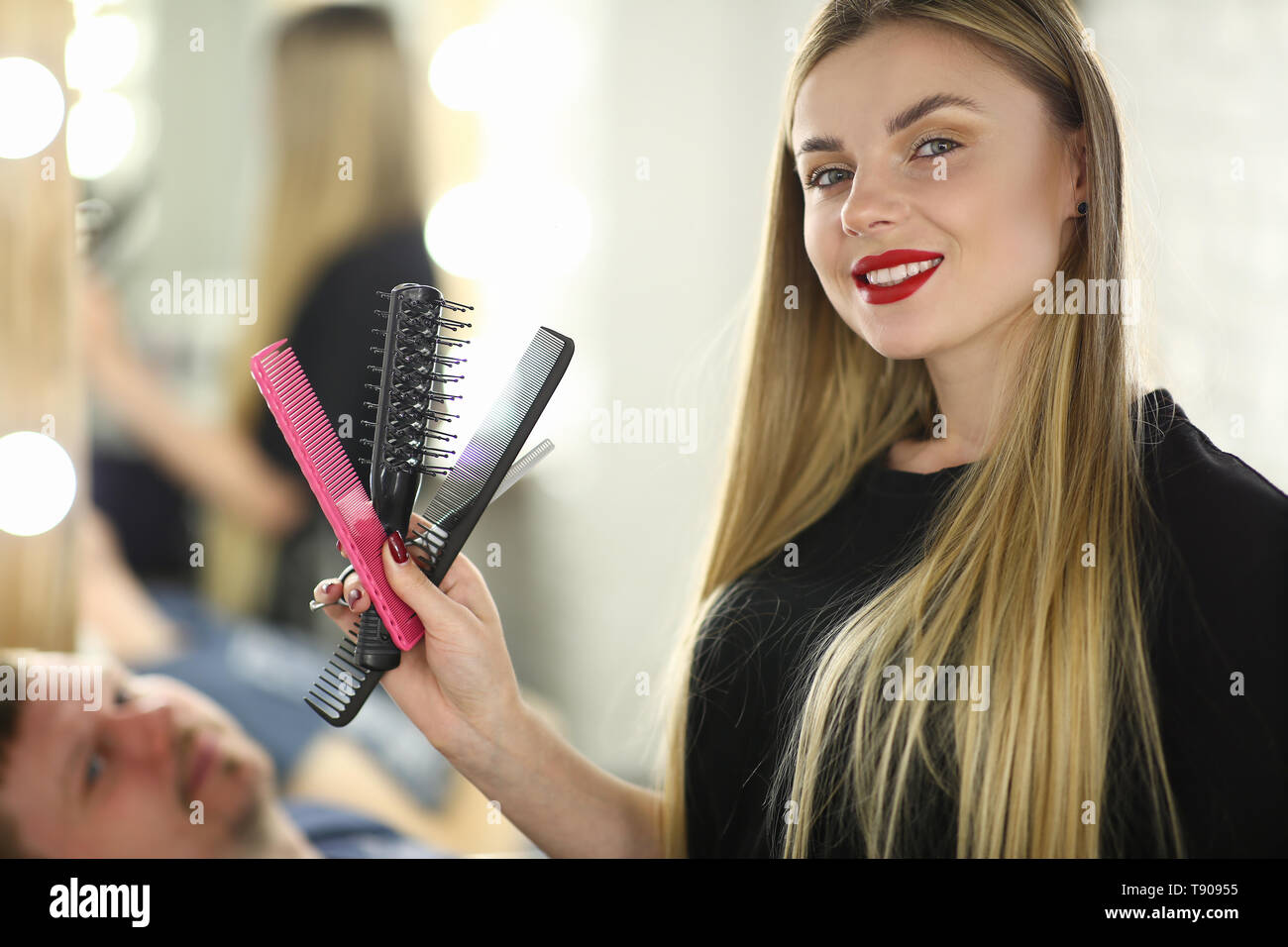 Professional Female Hairstylist With Hairbrush Stock Photo